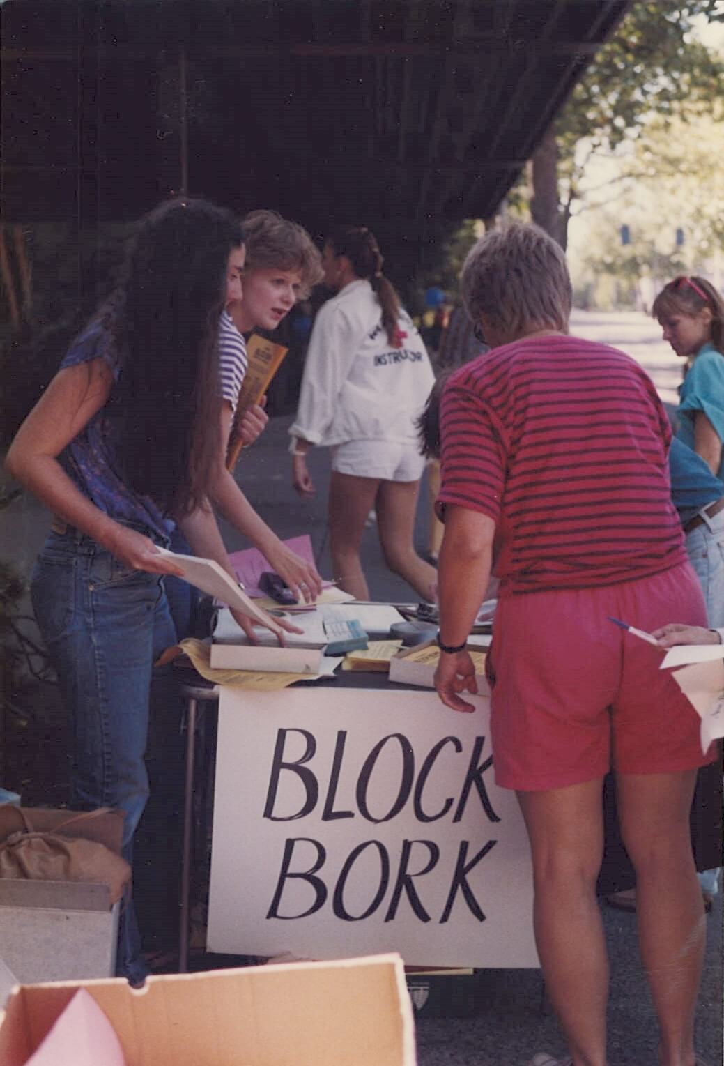 Volunteers at an event table with a "Block Bork" sign in 1986